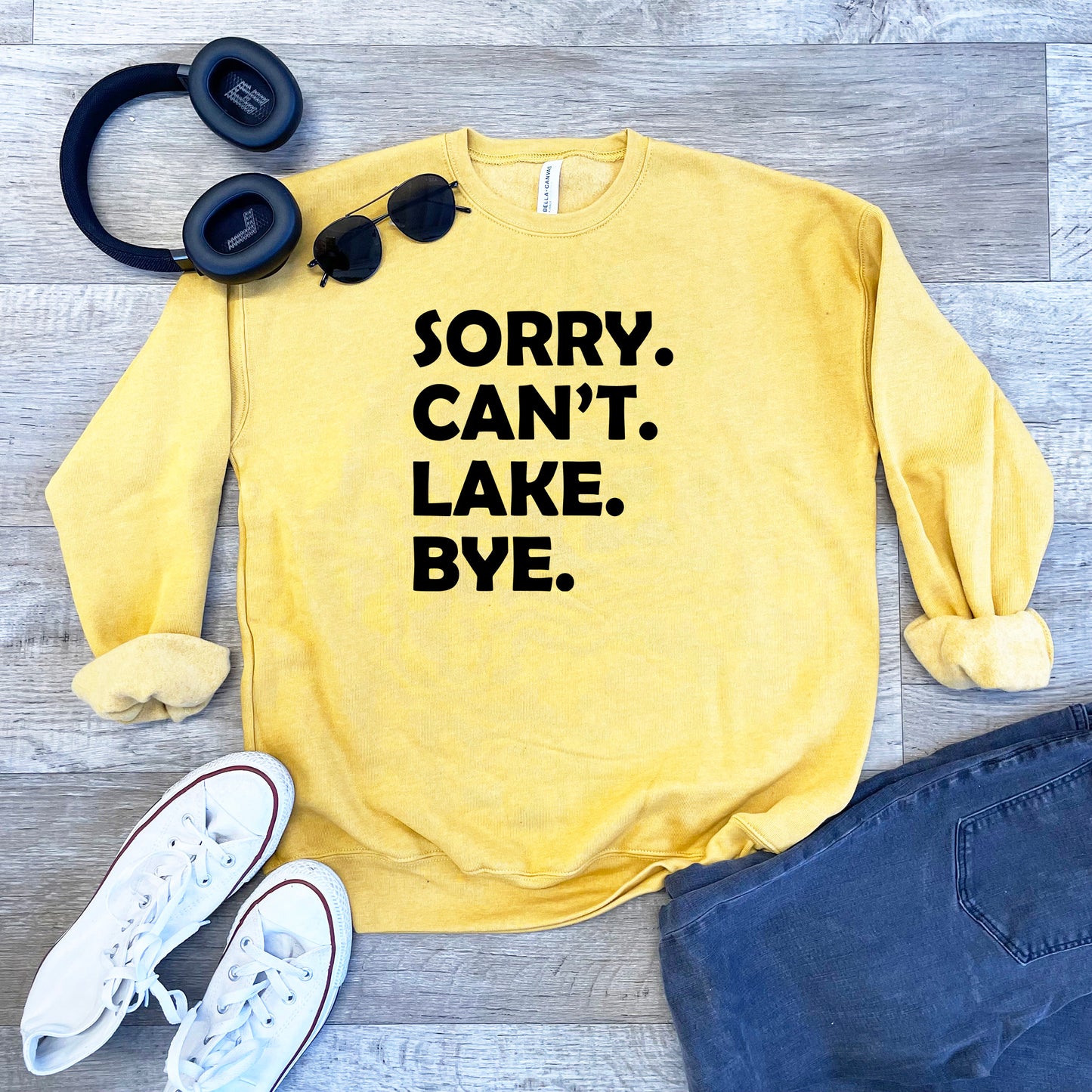 a yellow sweatshirt that says sorry, can't lake bye