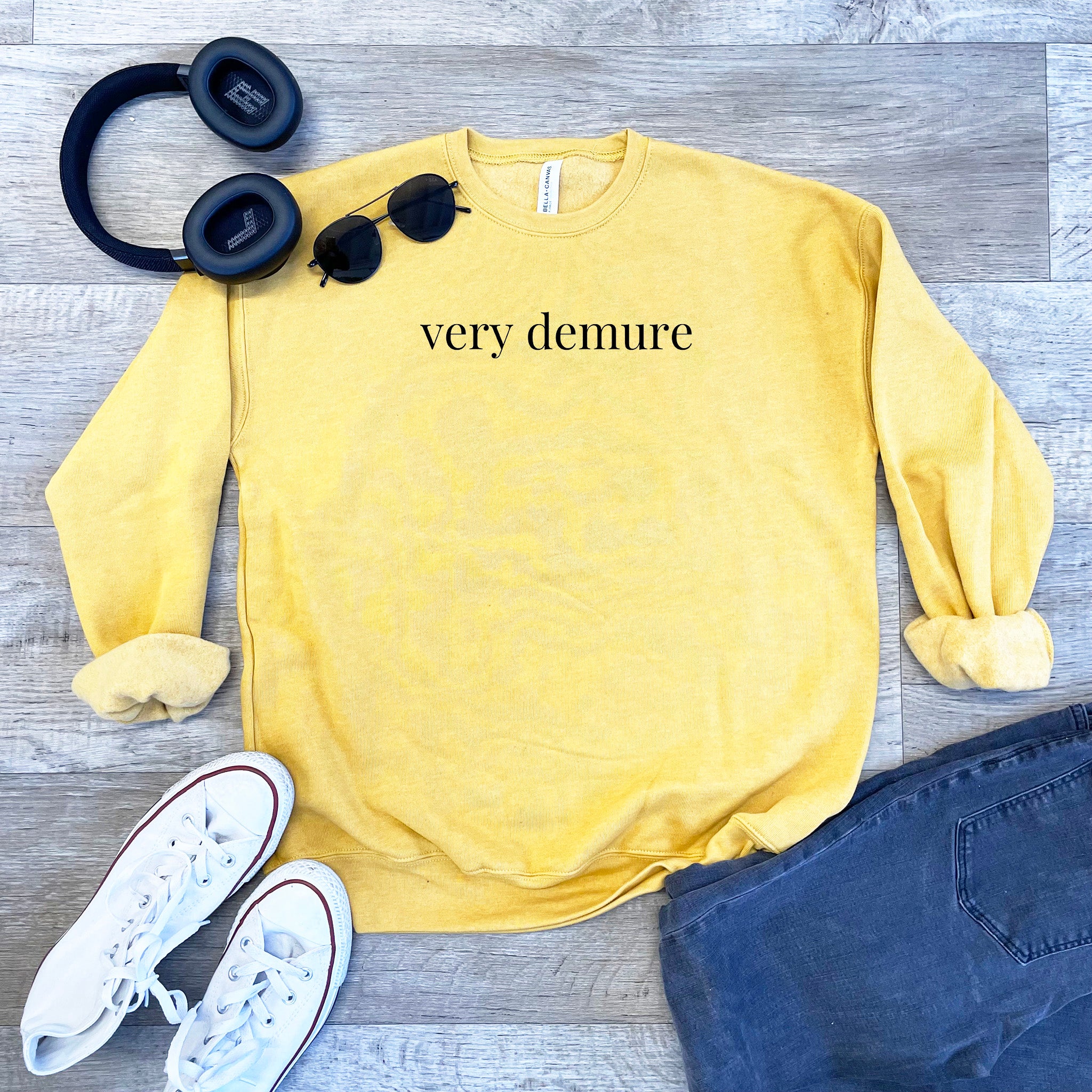 a yellow sweatshirt with the words very demure on it