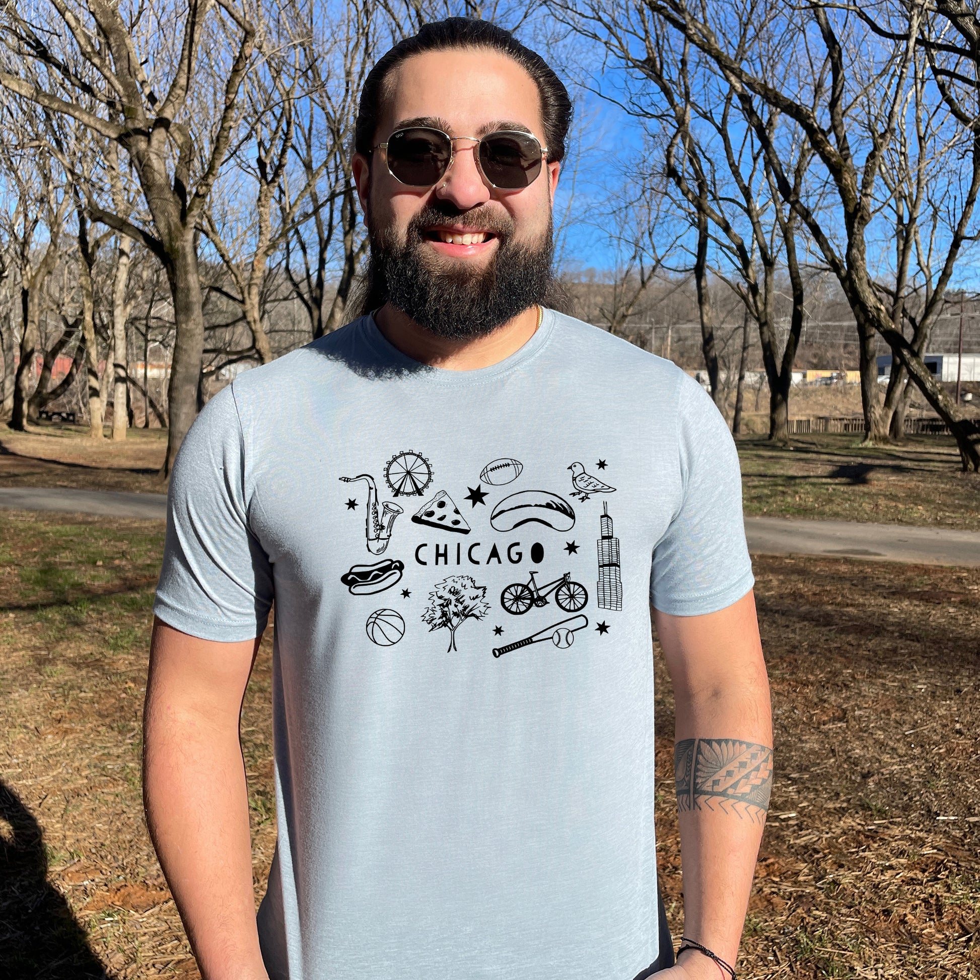 a man with a beard wearing a chicago t - shirt