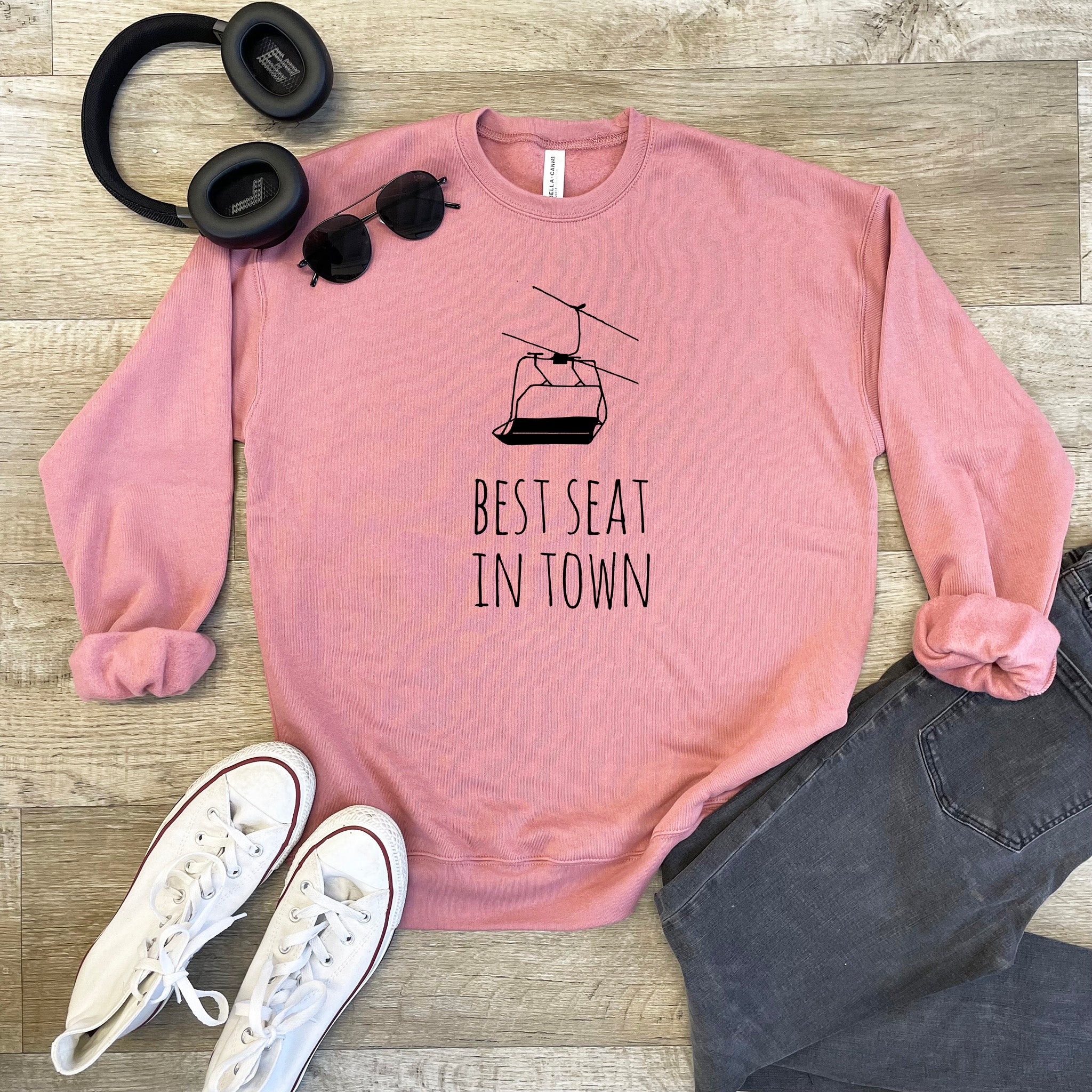 a pink sweatshirt that says best seat in town