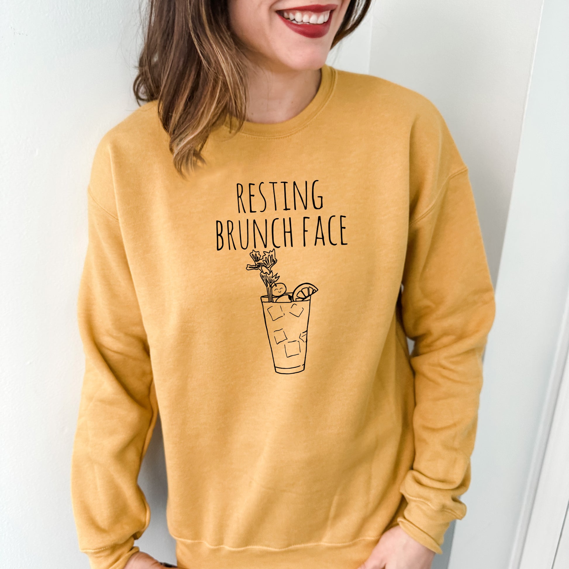 a woman wearing a sweatshirt that says resting brunch face