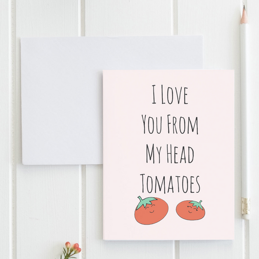 a card with two tomatoes on it and the words i love you from my head