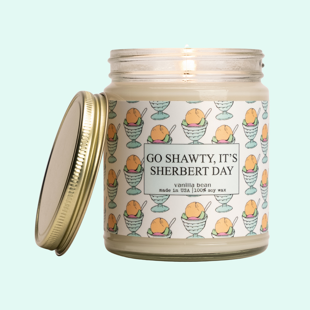 a jar of go shawly, it's sherbet day candle
