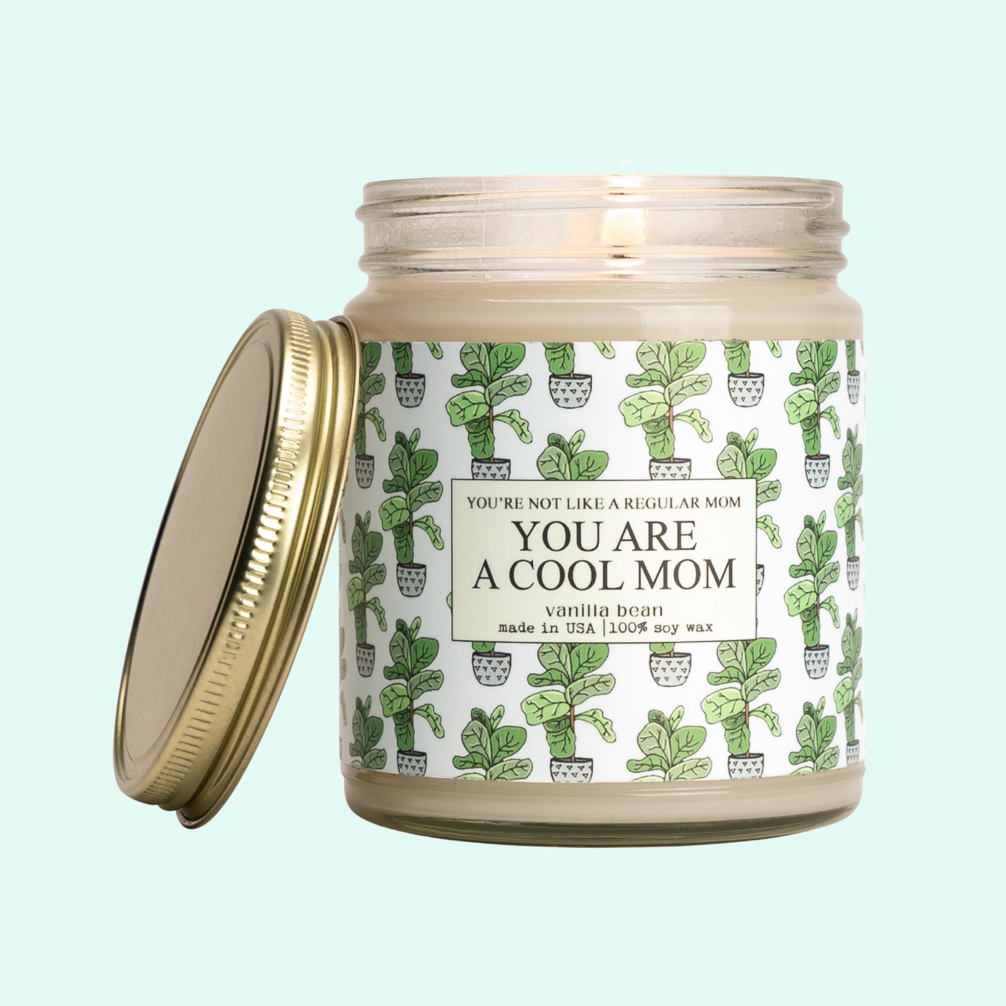 a jar of a candle with a cactus print on it