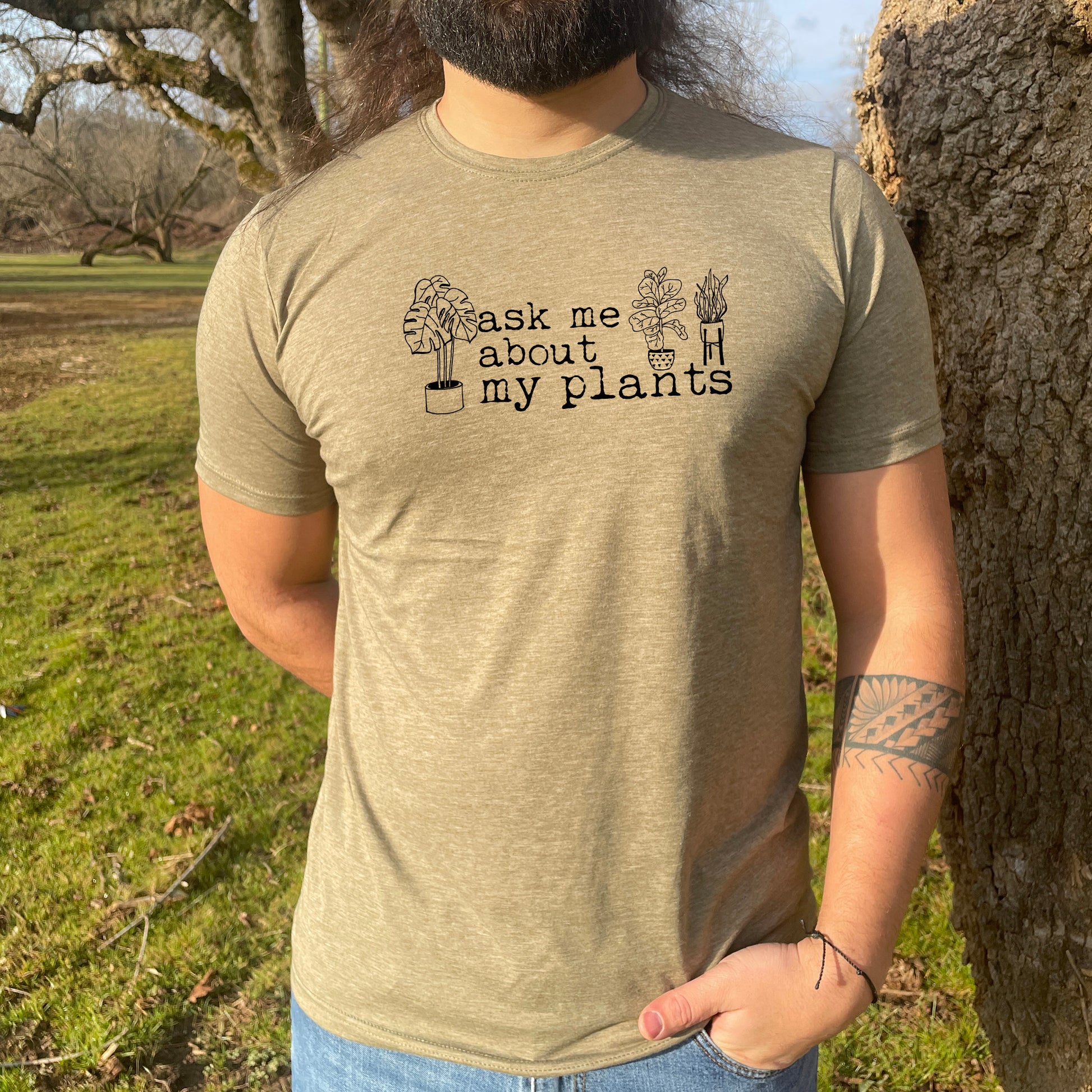 a man with a long beard wearing a t - shirt that says ask me about