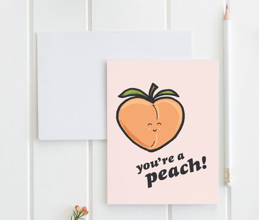 a greeting card with a peach on it