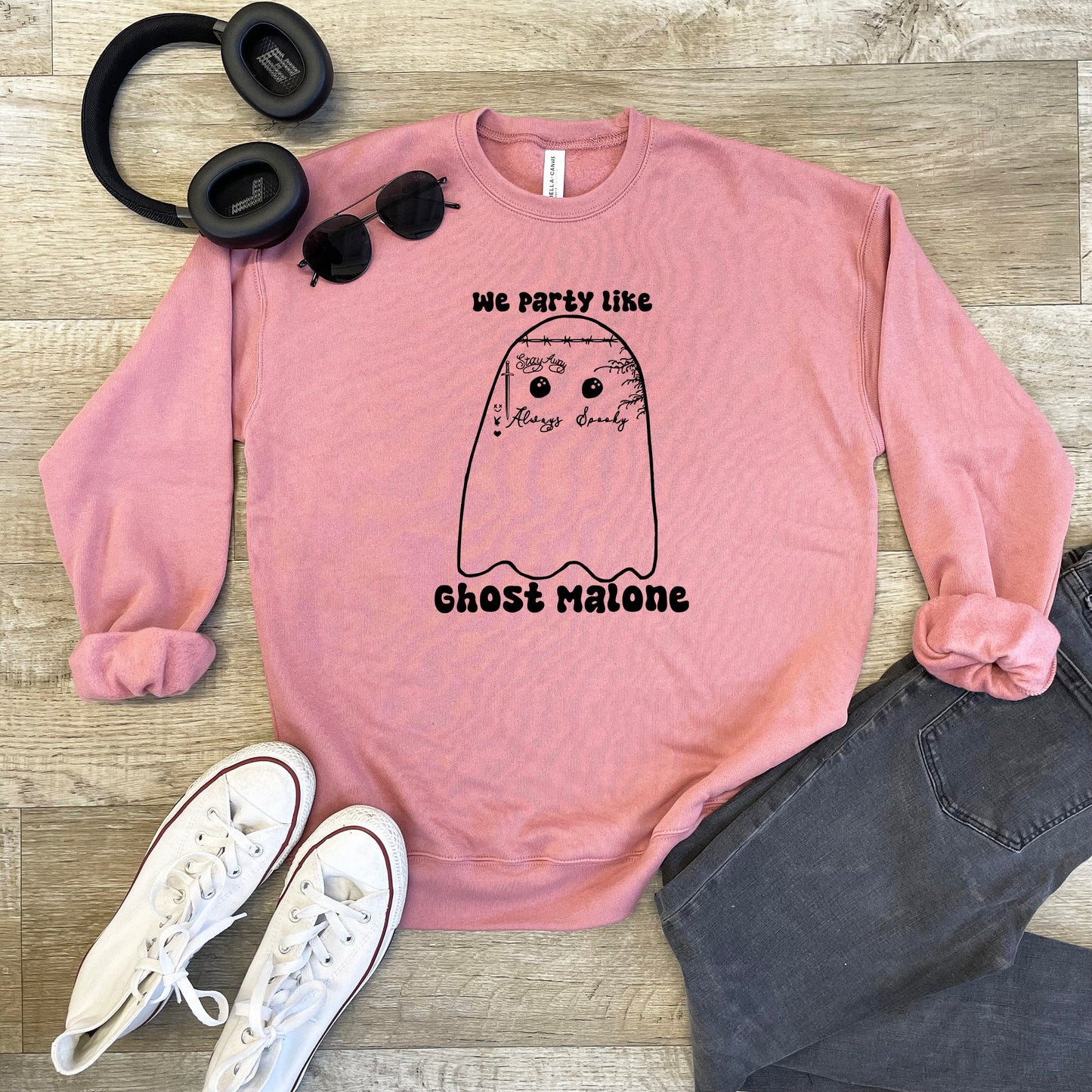 a pink sweatshirt with a ghost on it