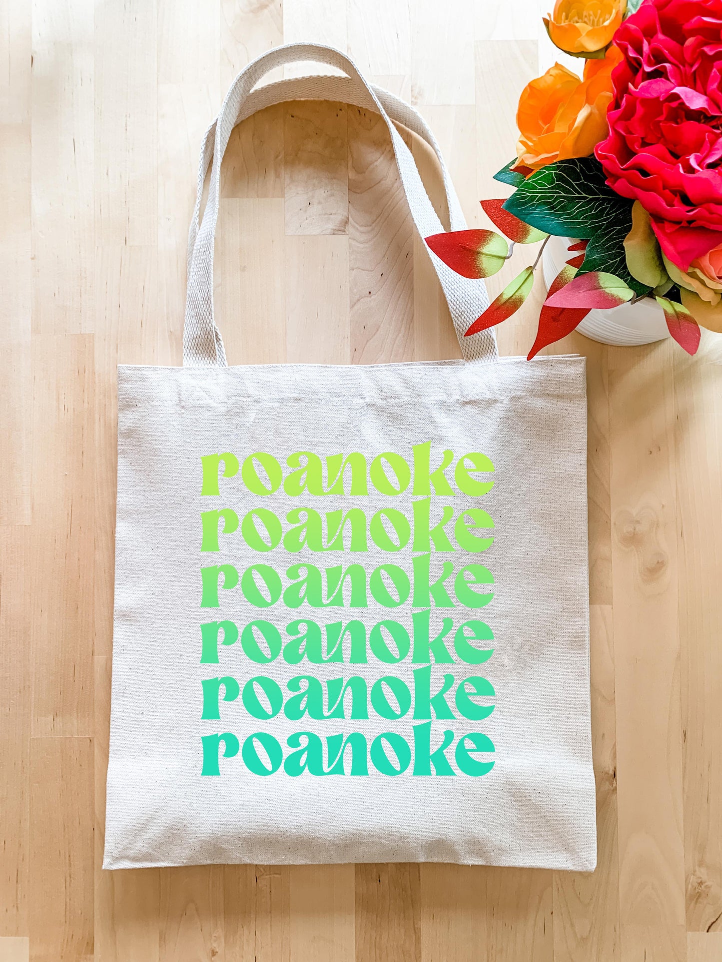 a tote bag sitting on top of a wooden floor