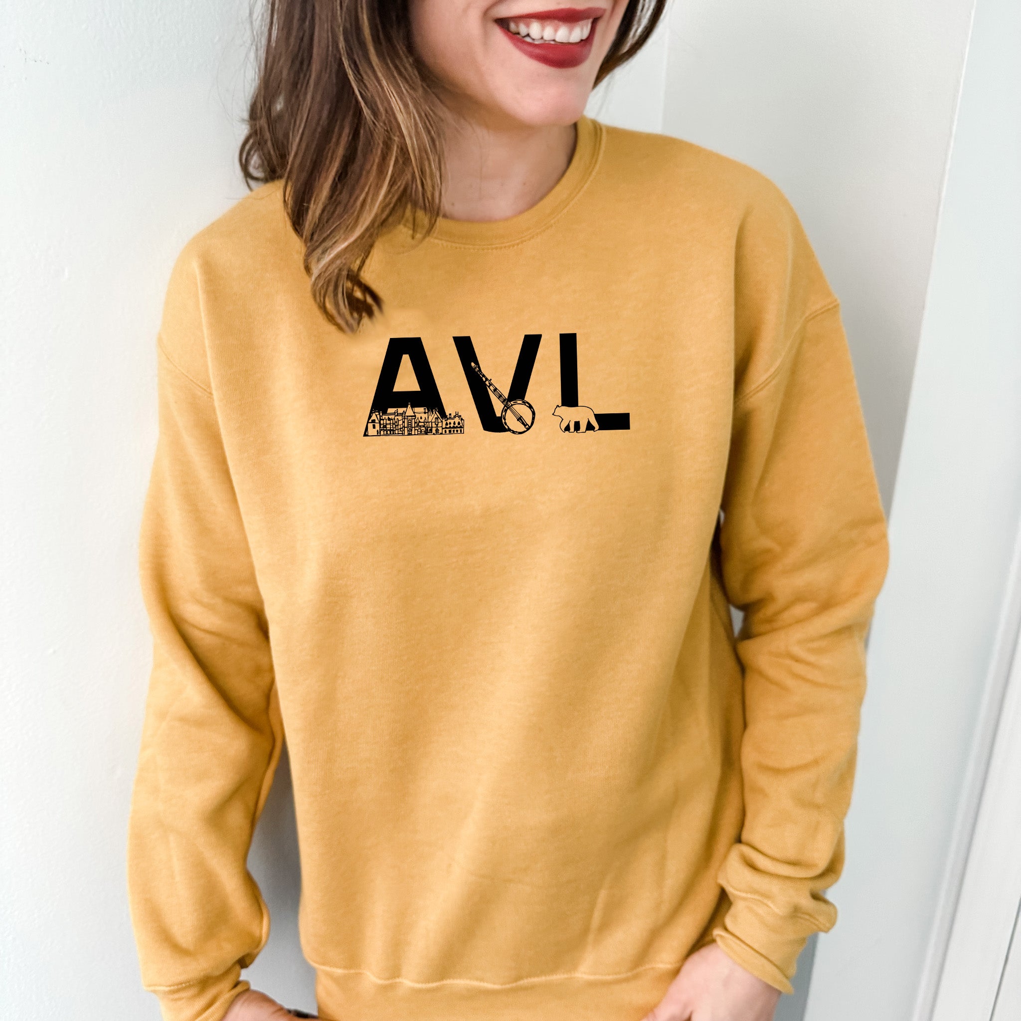 a woman wearing a yellow sweatshirt with the word lava on it