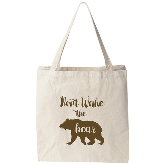 a tote bag that says short wake the bear