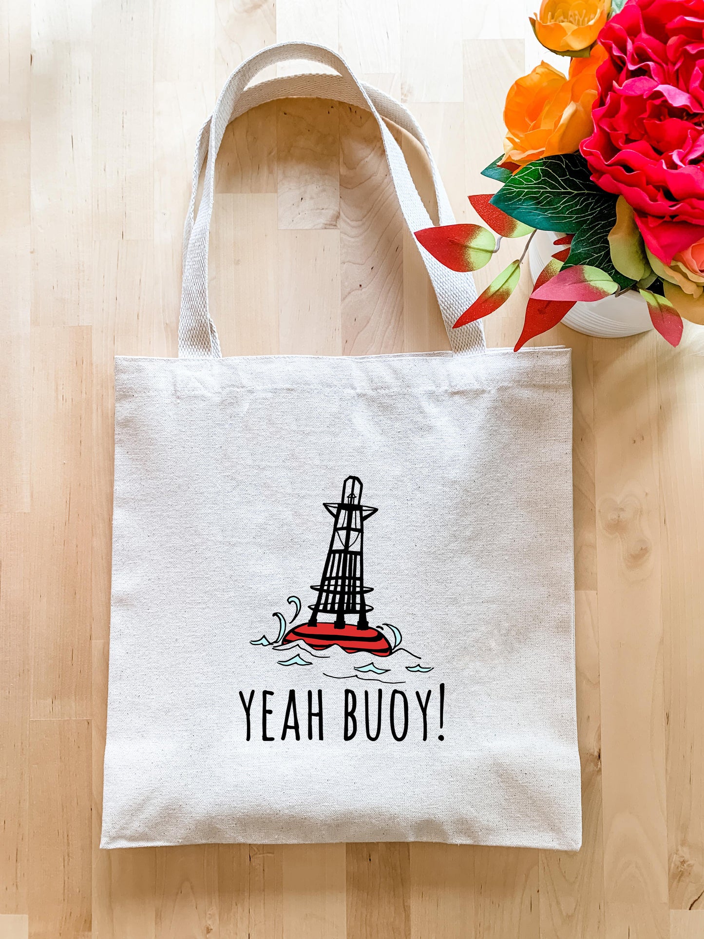 a tote bag sitting on top of a wooden floor