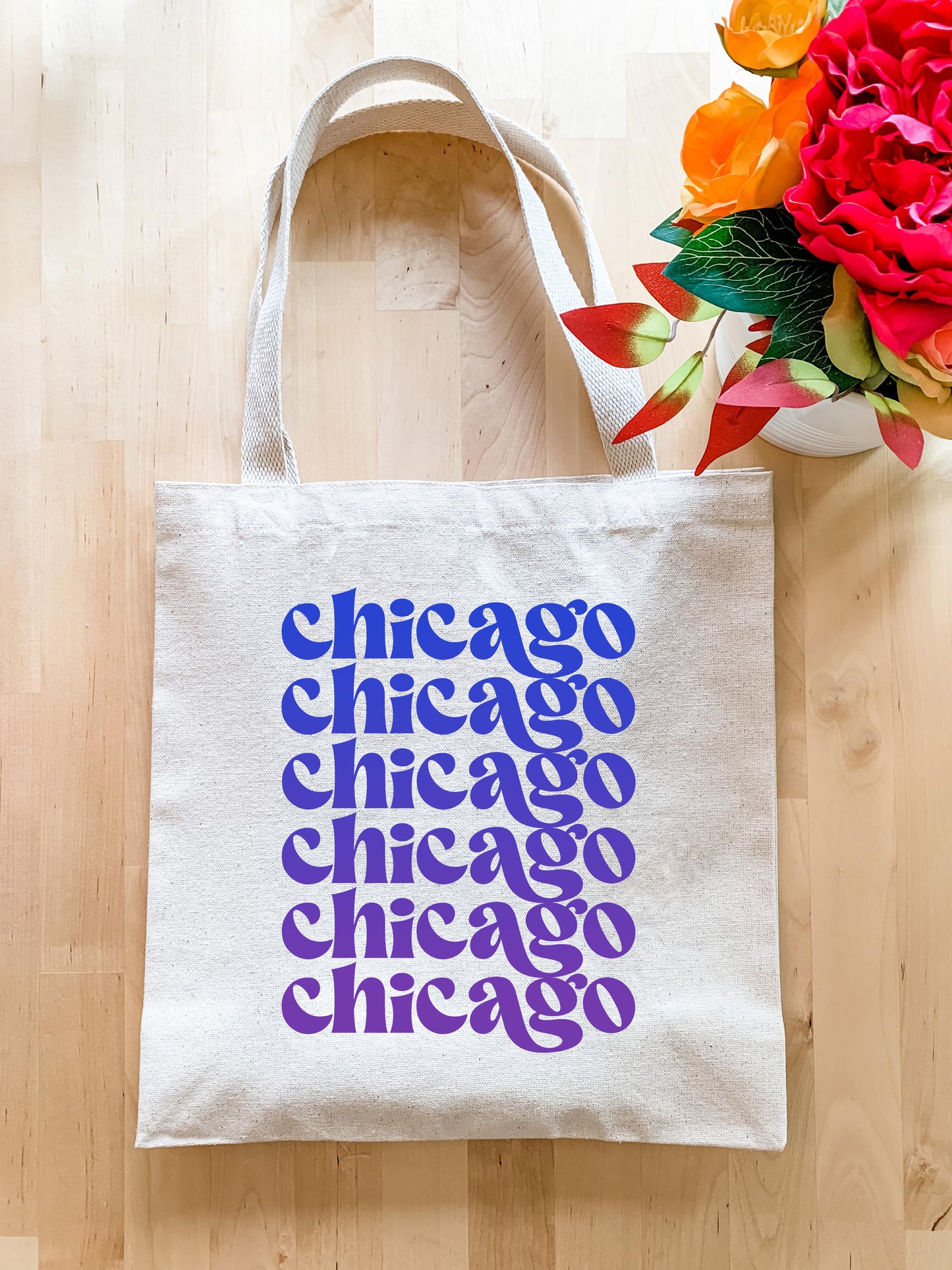 a tote bag sitting on top of a wooden floor