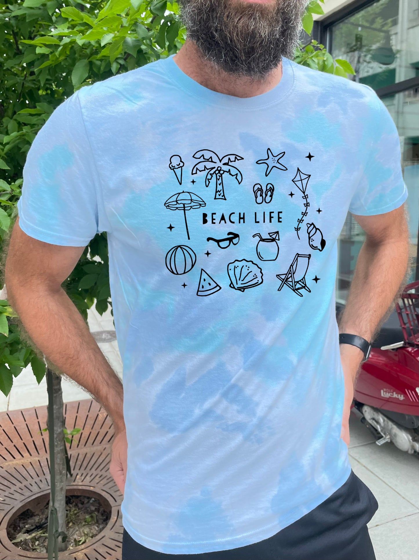 a man with a beard wearing a t - shirt that says beach life