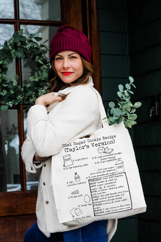a woman holding a bag with a description of the plant