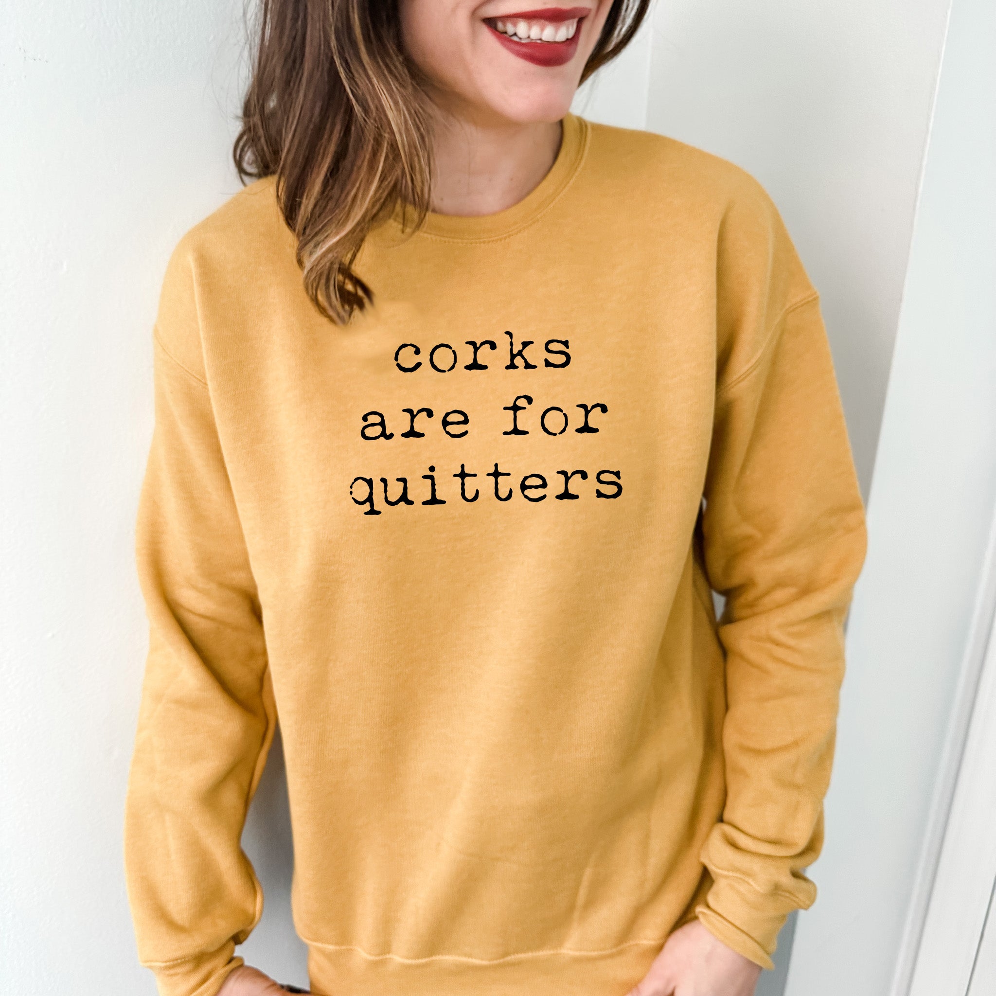 a woman wearing a sweatshirt that says cooks are for quitters