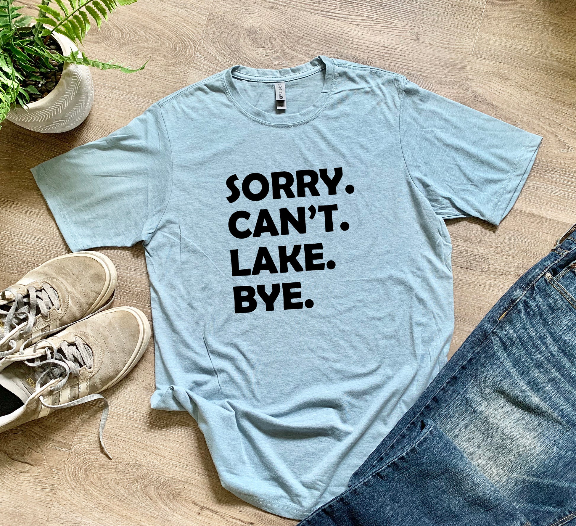 a t - shirt that says sorry can't lake bye