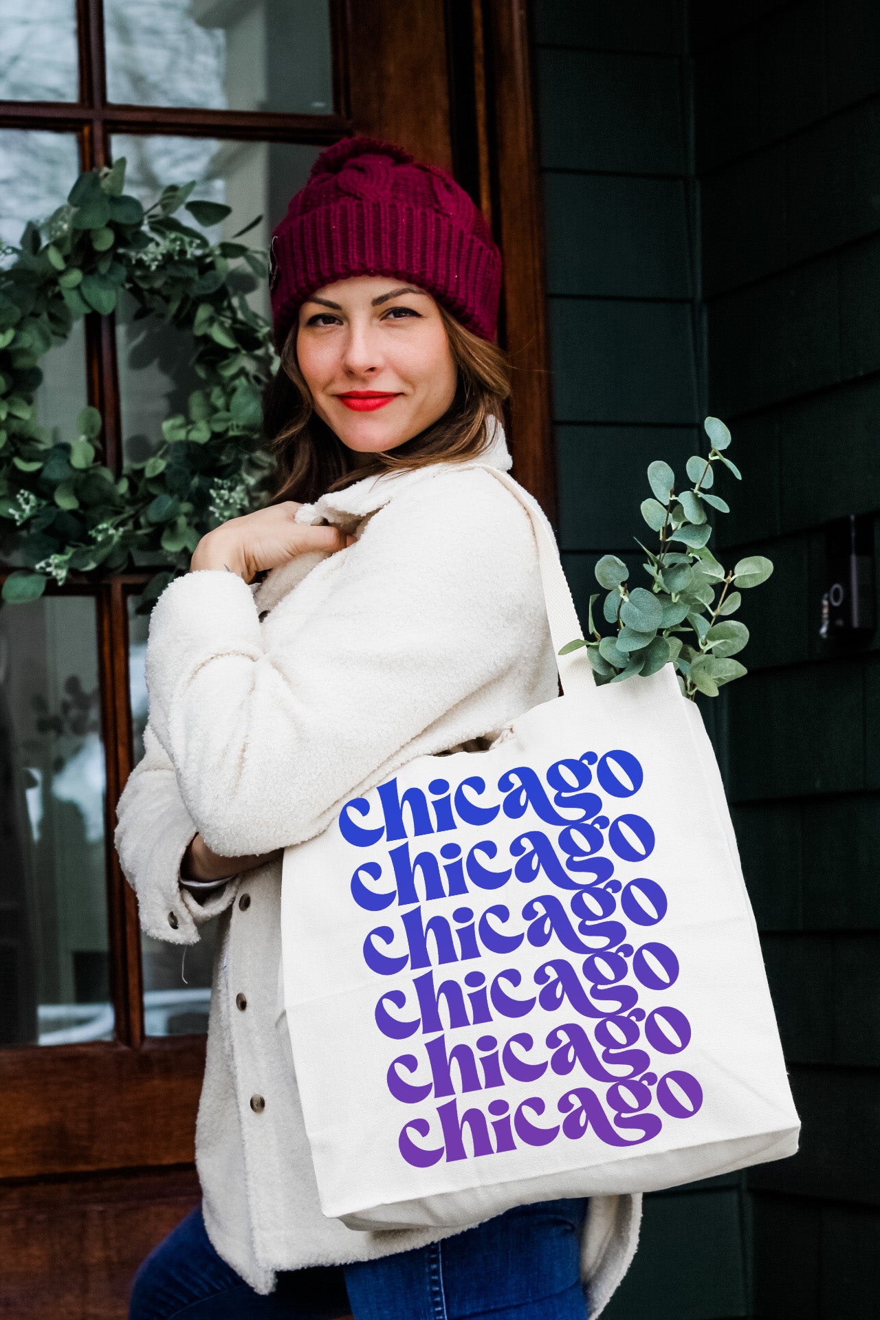 a woman carrying a chicago bag with the words chicago on it