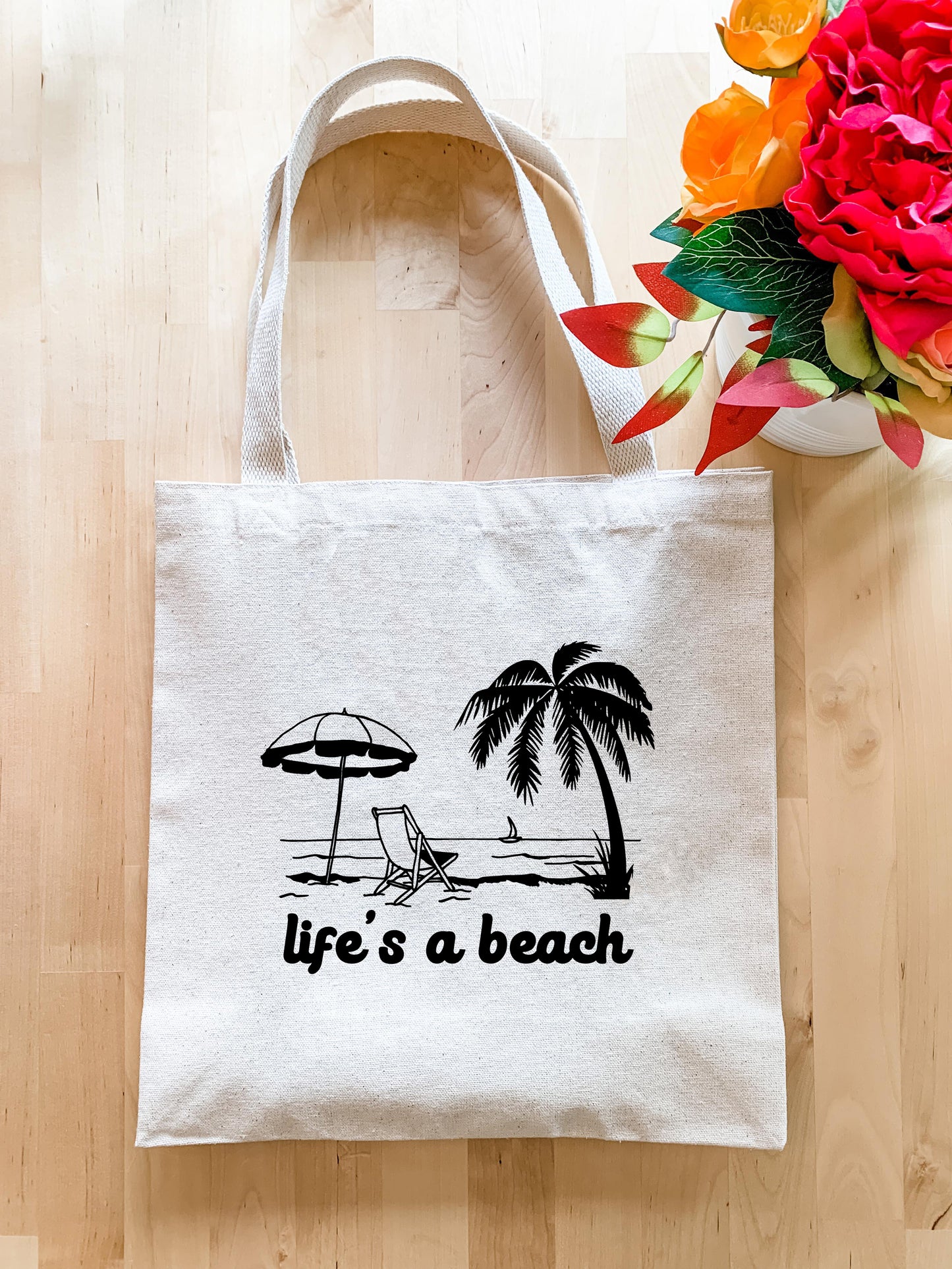 a tote bag with a picture of a beach scene