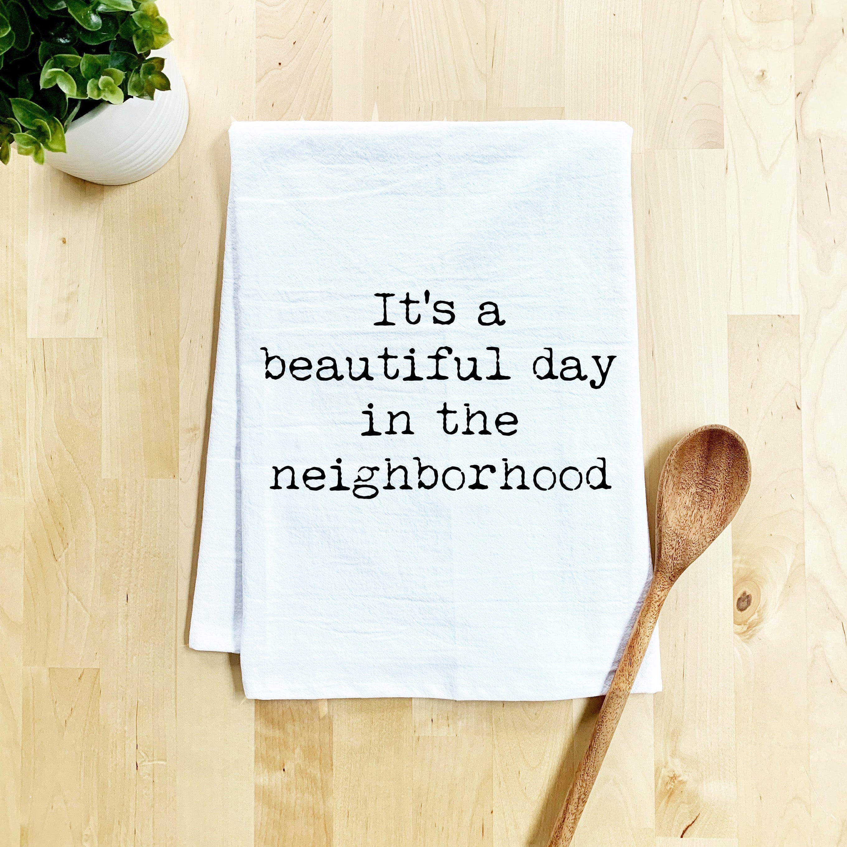 a tea towel that says it's a beautiful day in the neighborhood