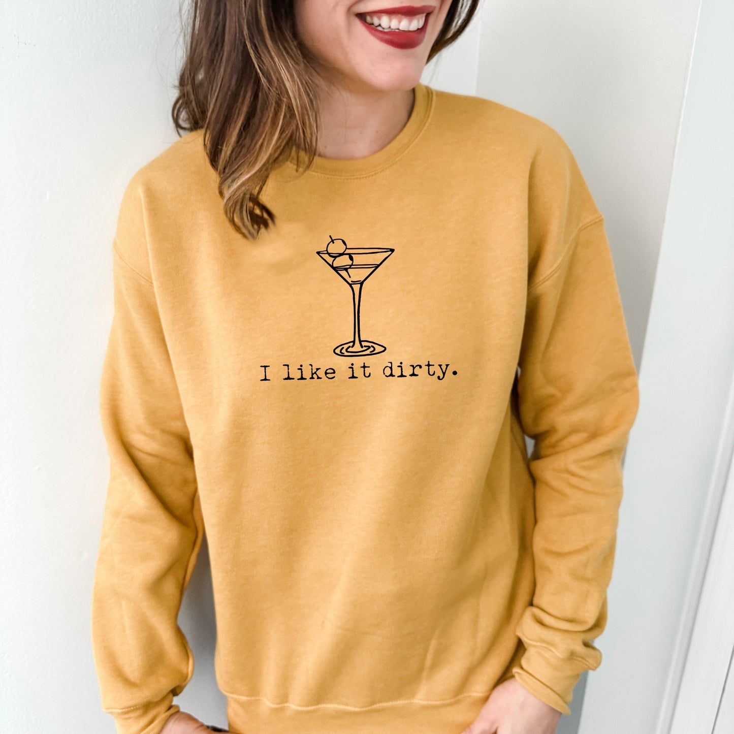 a woman wearing a sweatshirt that says i like it dirty