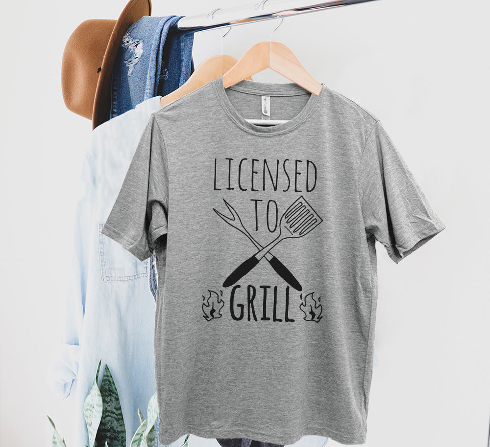 Licensed To Grill - Men's / Unisex Tee - Stonewash Blue, Sage, Lavender, or Heather Gray