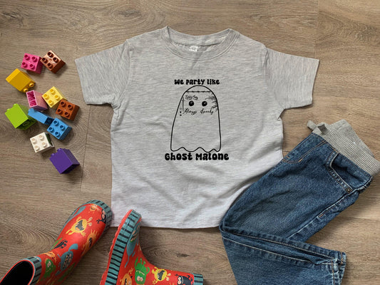a child's t - shirt with an image of a ghost on it