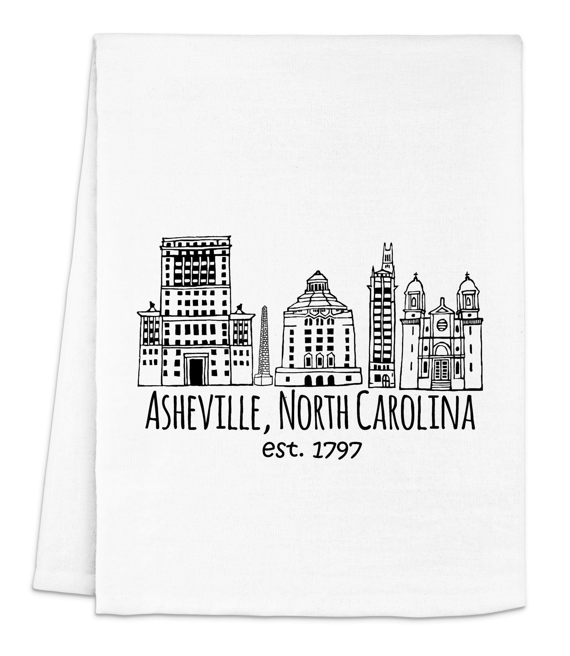 a white dish towel with a black and white skyline