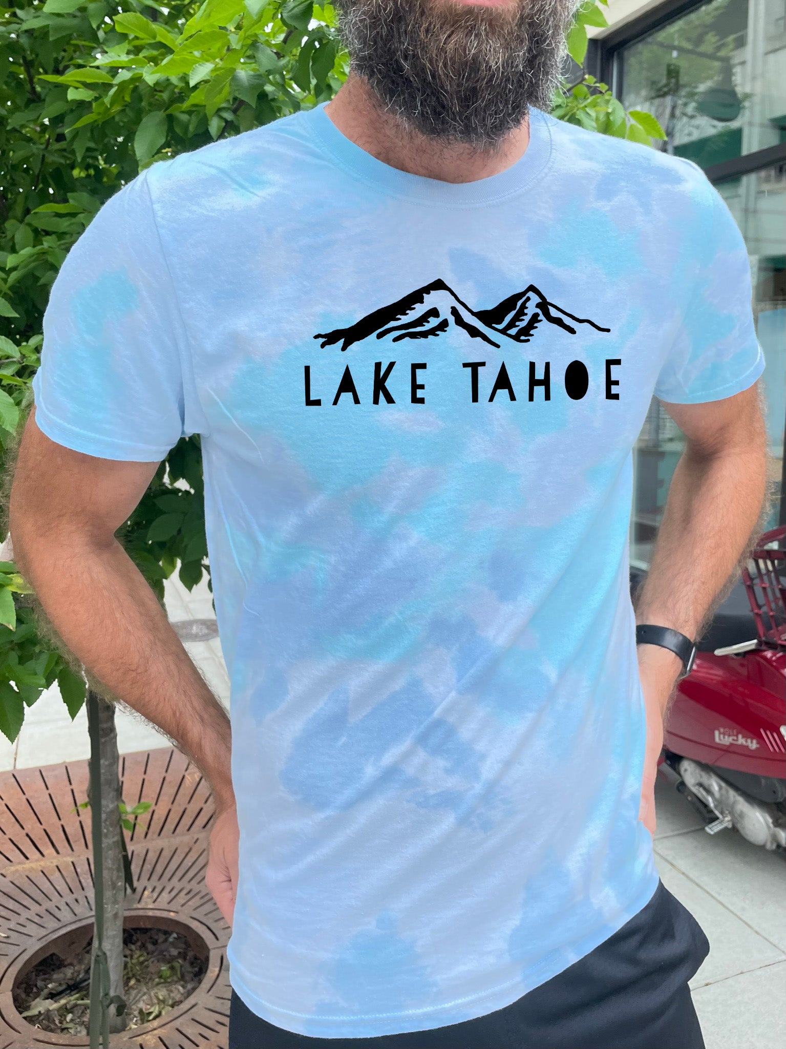 a bearded man wearing a lake tahoe t - shirt