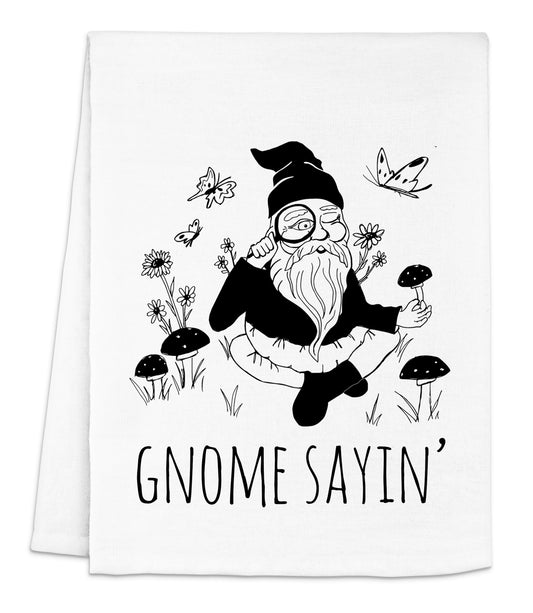 a black and white photo of a gnome on a white towel