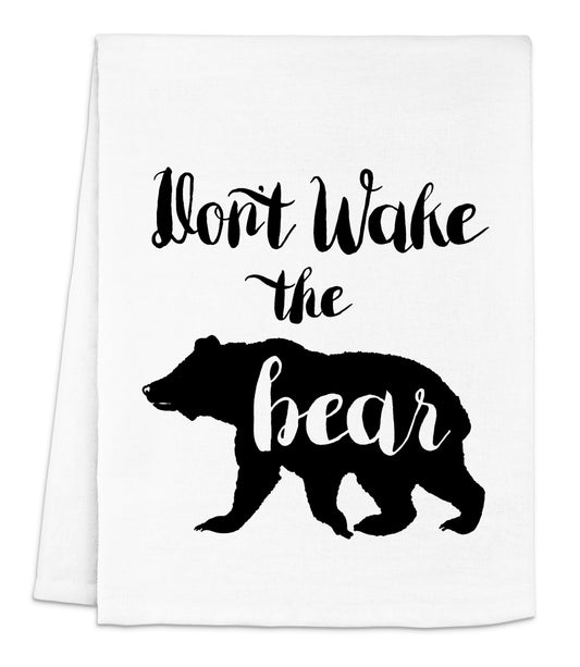 a tea towel with the words don't wake the bear on it