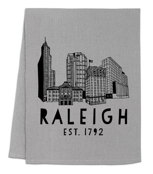 a gray towel with a black and white image of a city