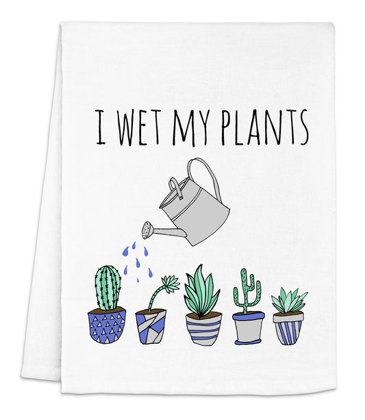a tea towel with a watering can and potted cacti