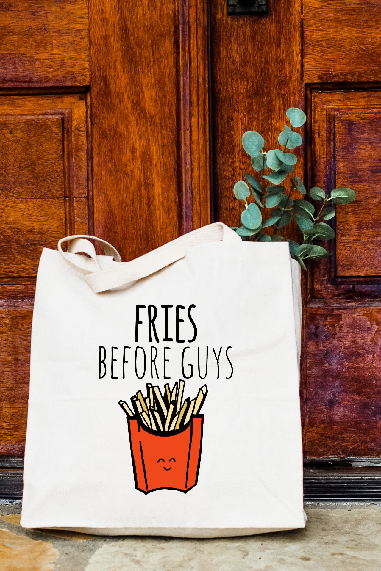a white bag with fries before guys on it