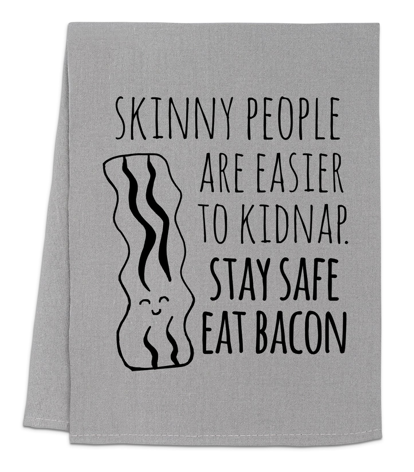 a towel with the words skinny people are easier to kidnapped stay safe eat bacon