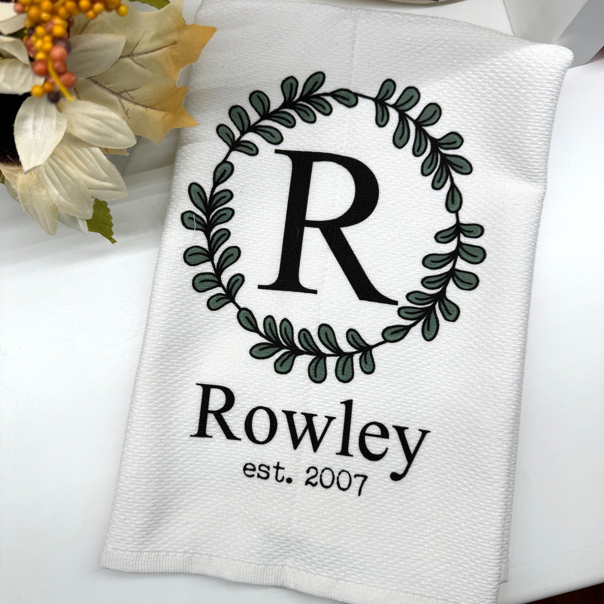 a towel with a monogrammed r on it