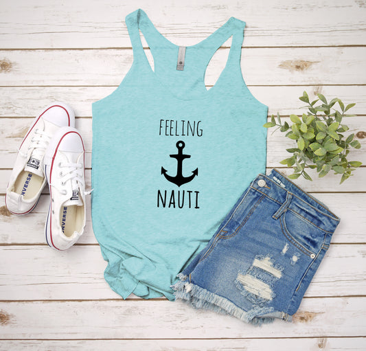 a tank top that says feeling nautit next to a pair of shorts