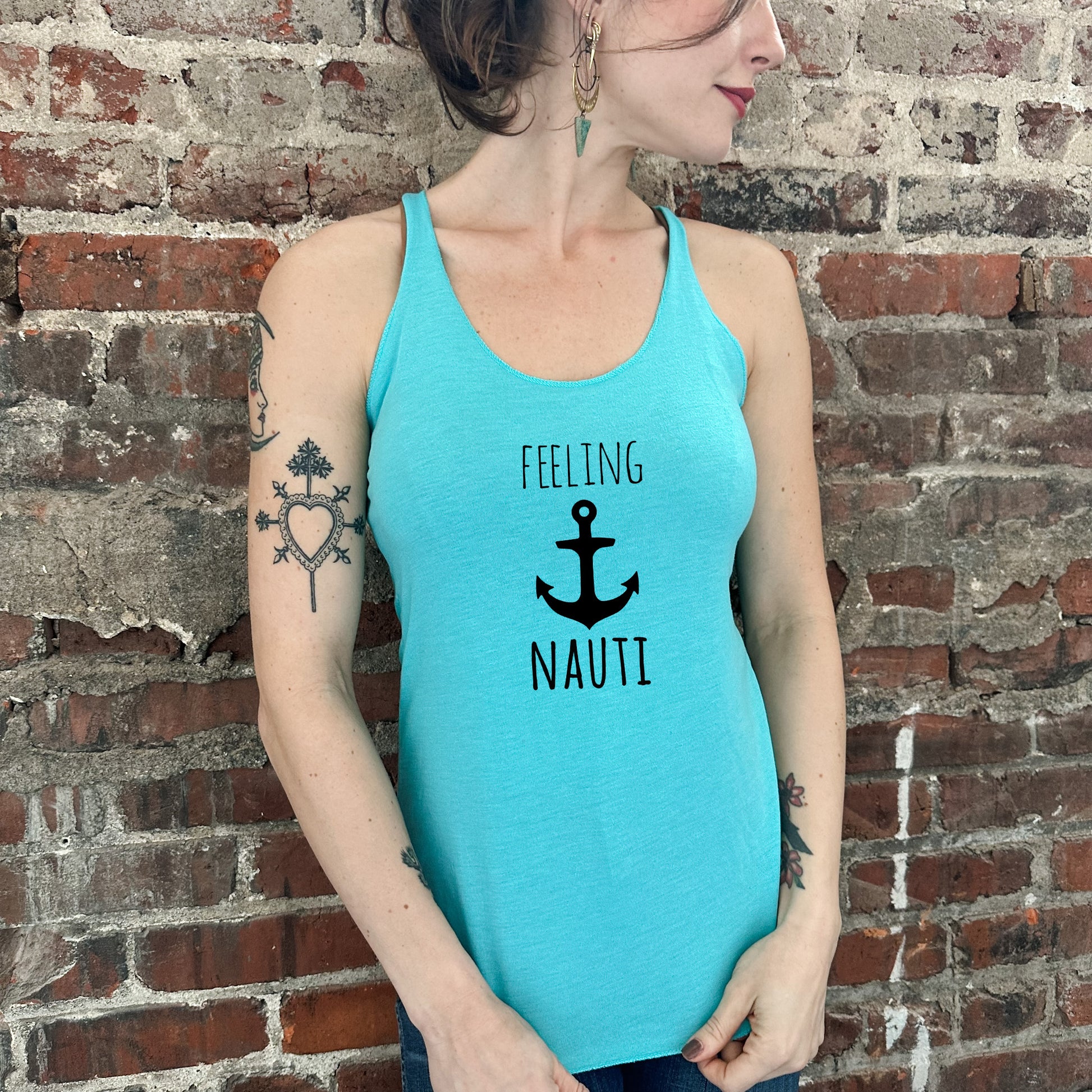 a woman wearing a tank top that says feeling nautit