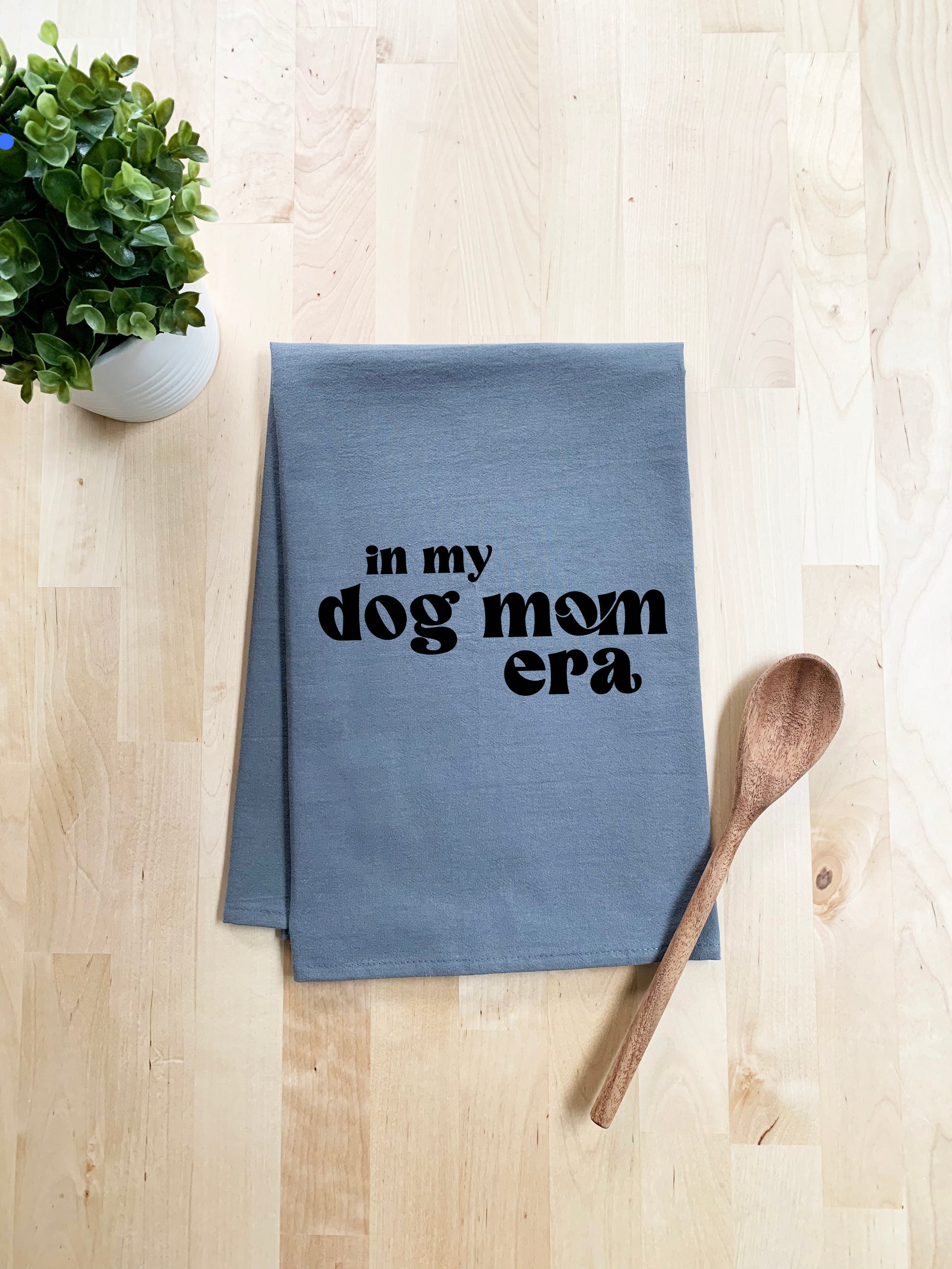 a tea towel with the words in my dog mom era printed on it