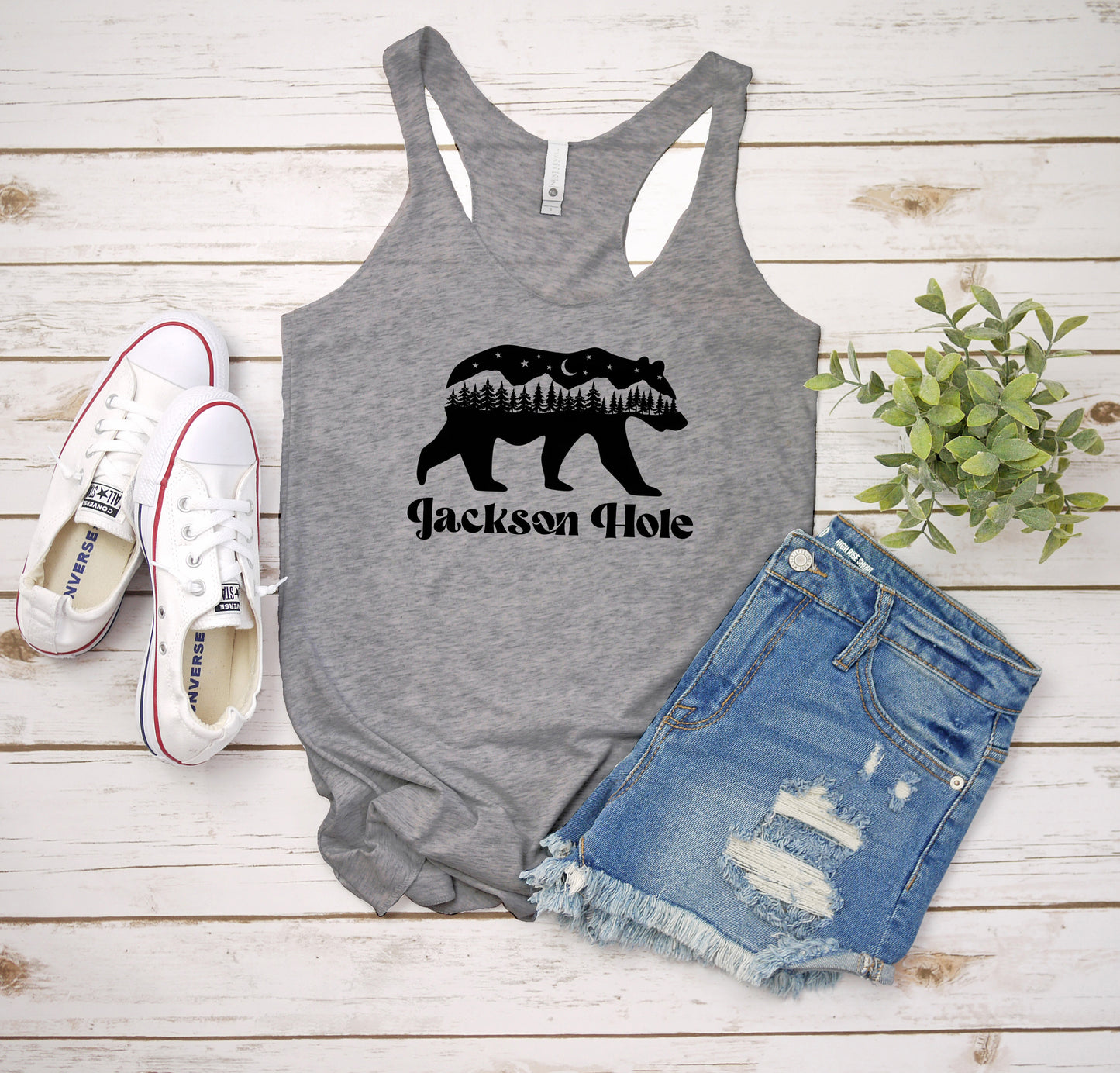 a tank top that says jackson hole with a bear on it