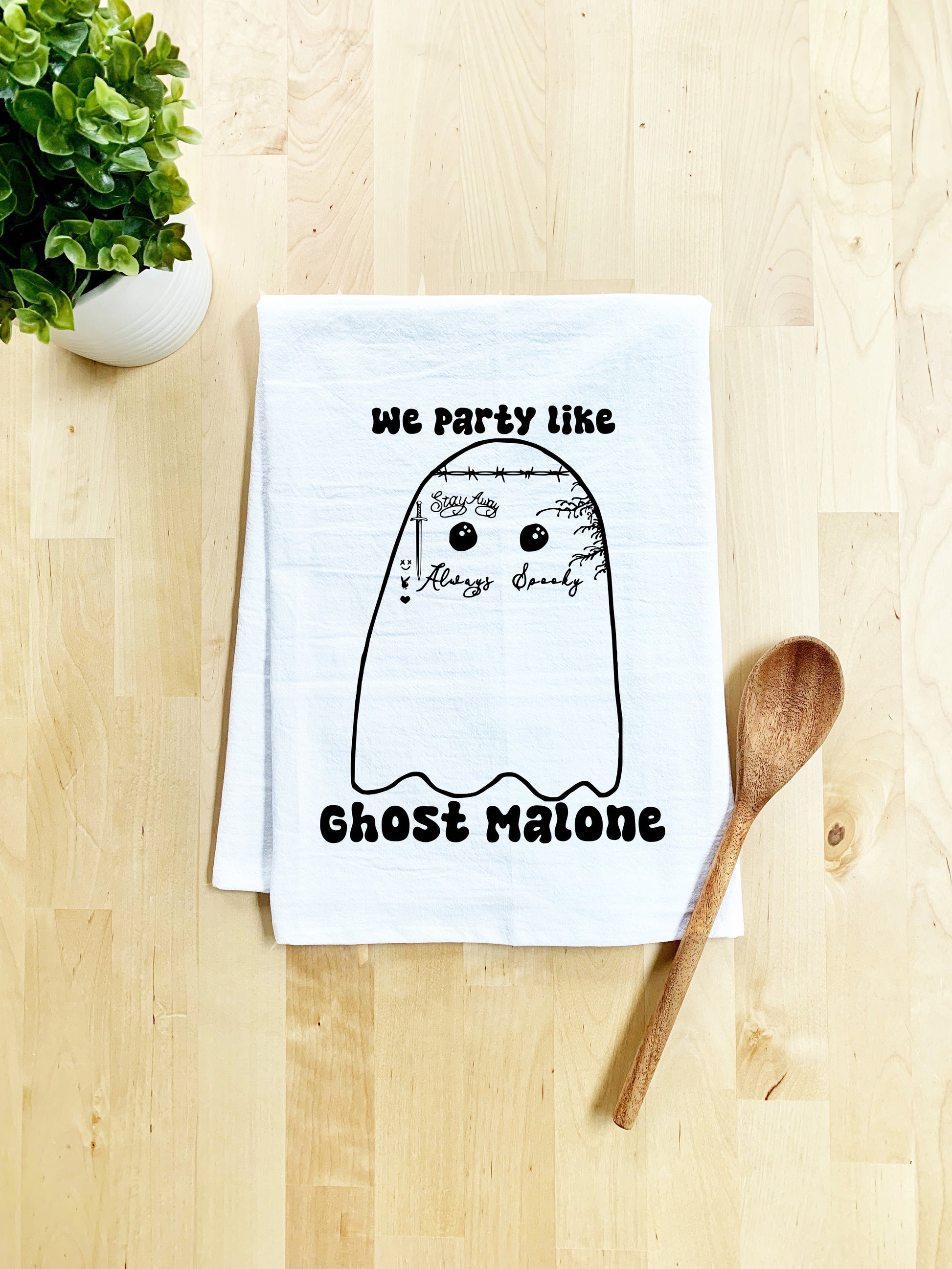 a tea towel with a ghost face on it