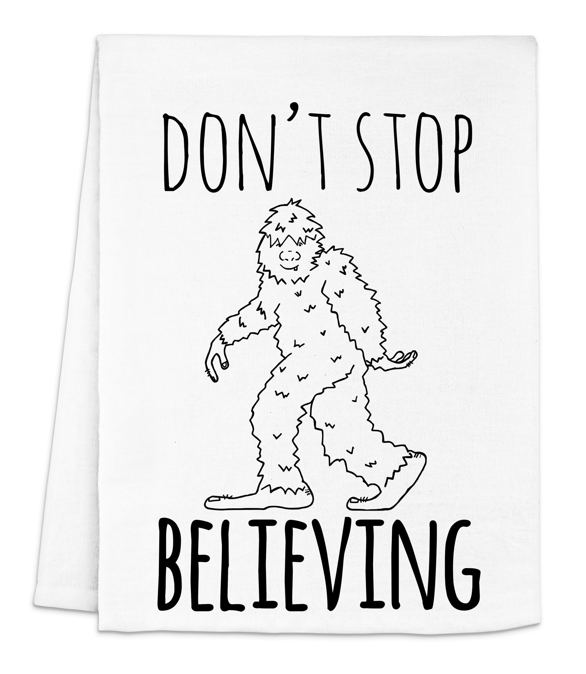 a white napkin with a drawing of a bigfoot saying don't stop believing