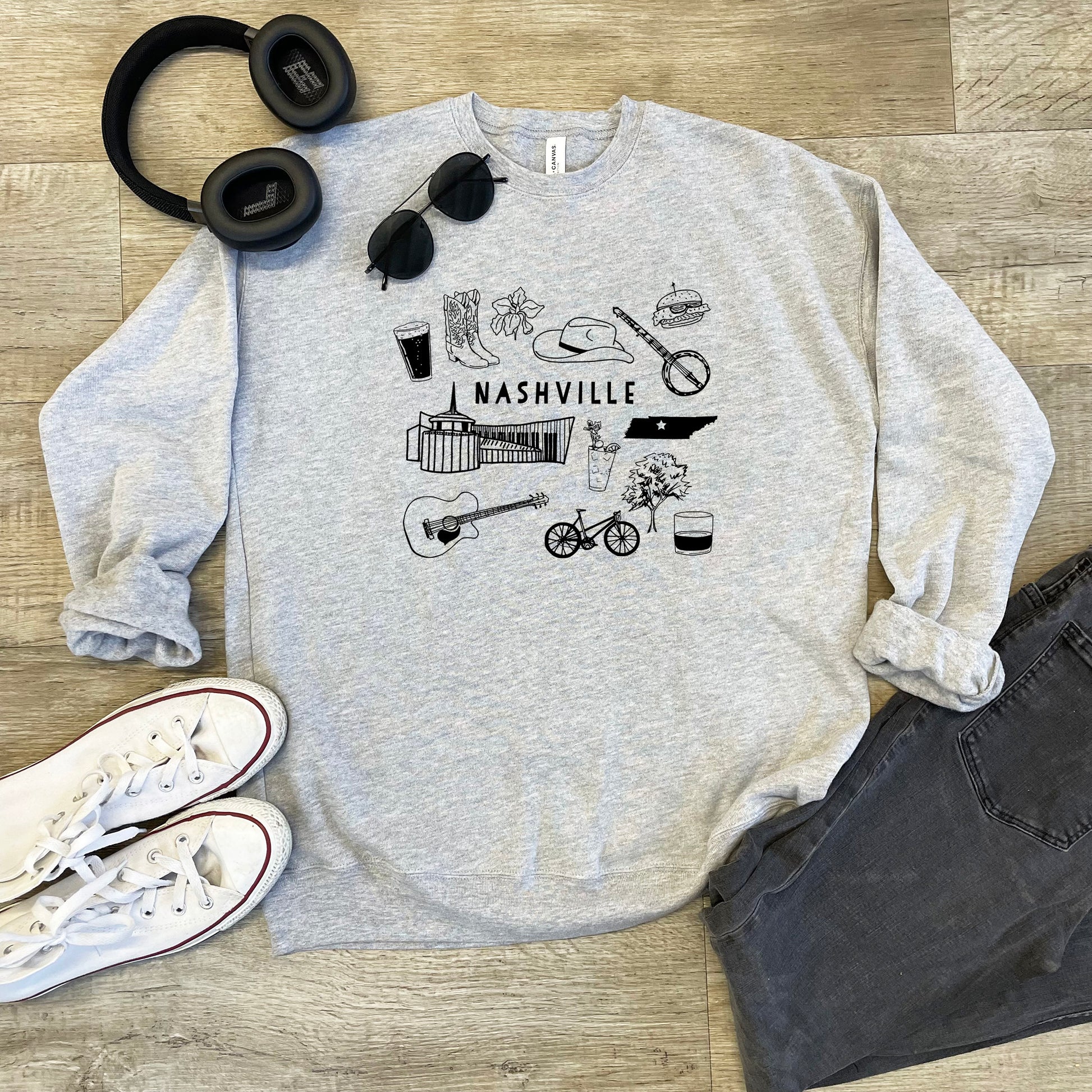 a sweatshirt with a picture of nashville and headphones