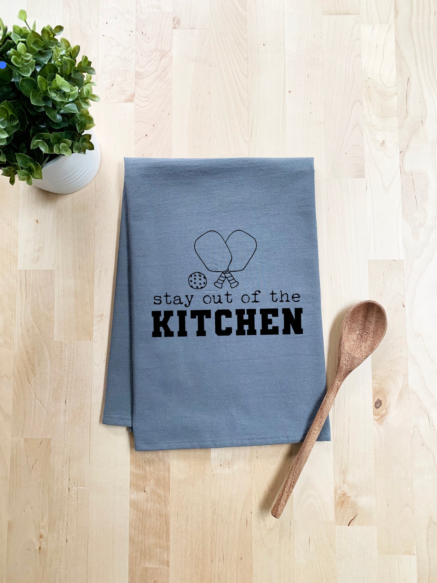 a tea towel that says stay out of the kitchen