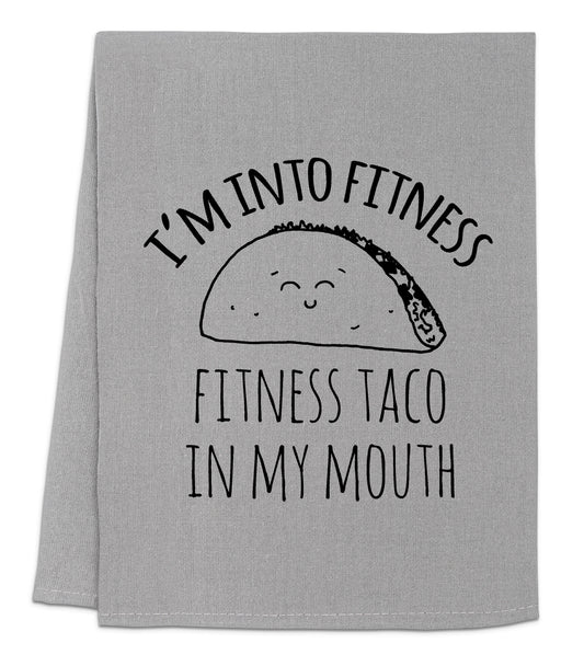 a towel that says i'm into fitness and a taco in my mouth
