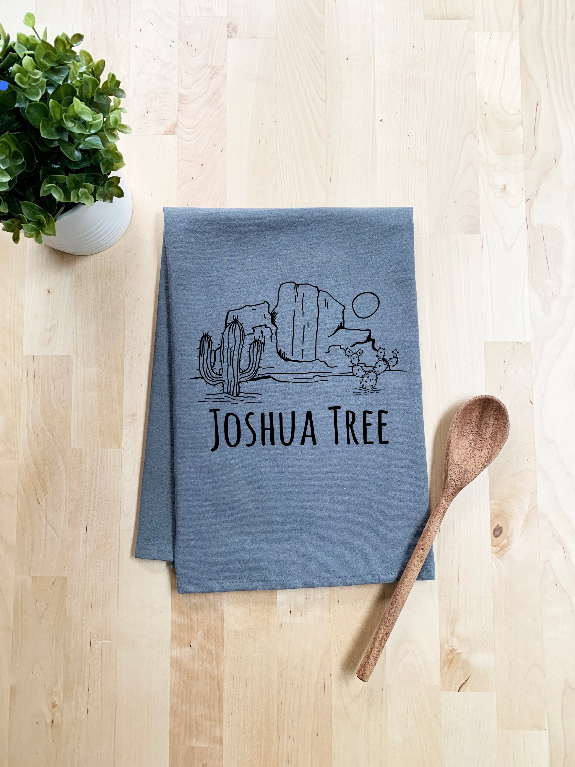 a tea towel with the words joshua tree on it