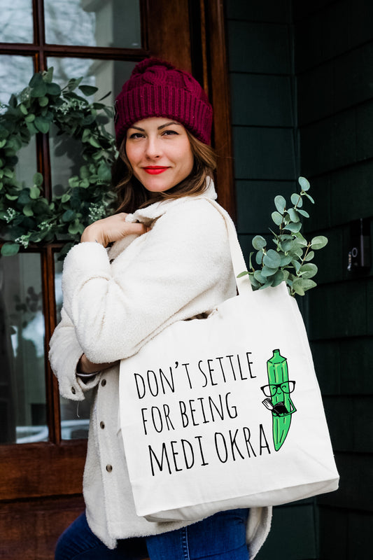 a woman holding a bag that says don't selte for being med
