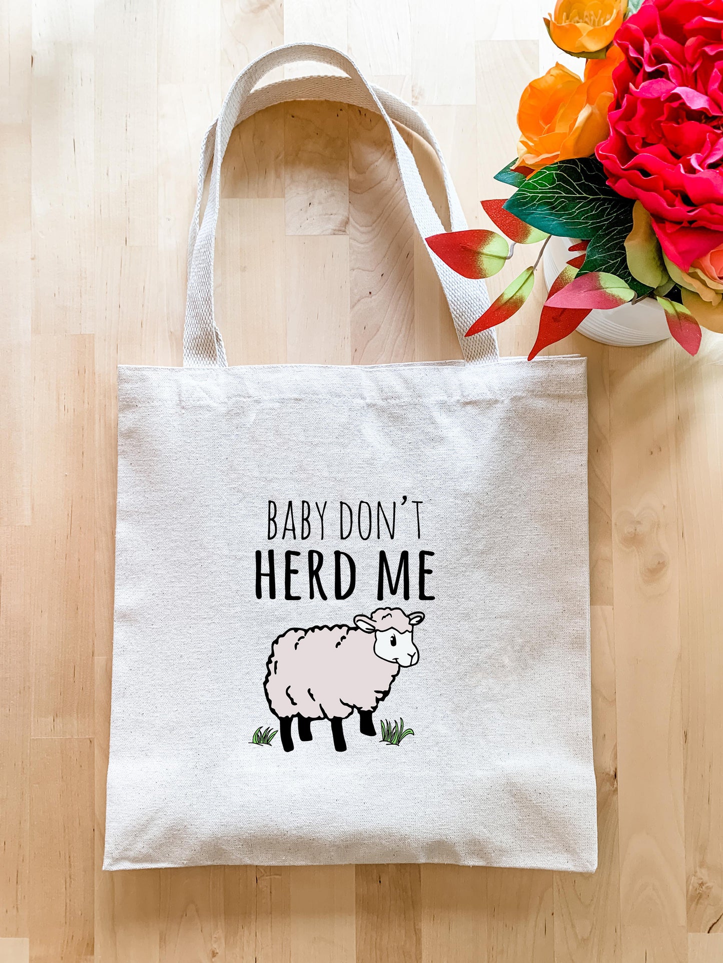 a tote bag with a picture of a sheep on it