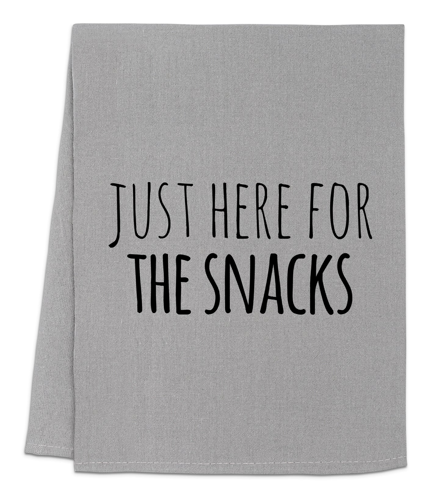 a towel that says just here for the snacks