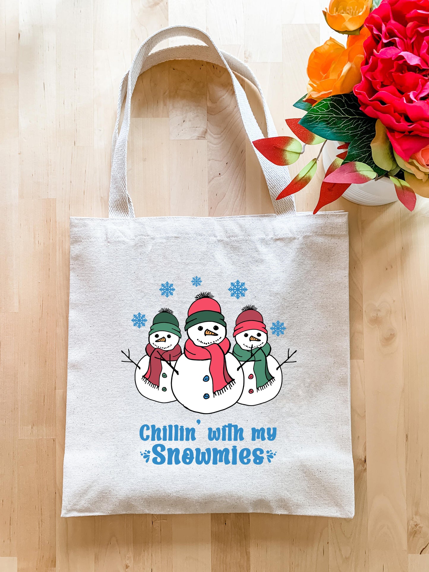a white bag with two snowmen on it