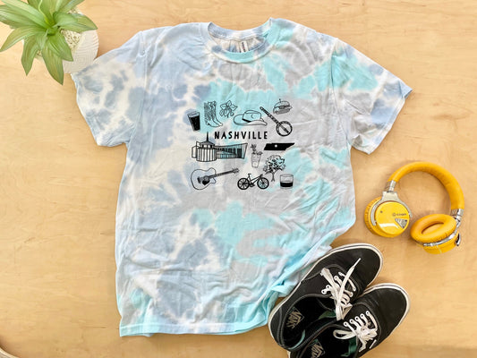 a tie dye shirt with a picture of a bike and headphones
